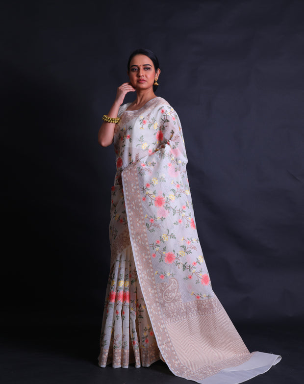 The off-white fancy cotton saree with shades of beige woven in thread as the border and pallu,- FCT011150