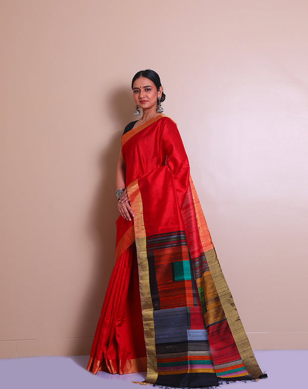 The red raw silk saree with a gold zari border, paired with a contrast black pallu - KSL02734