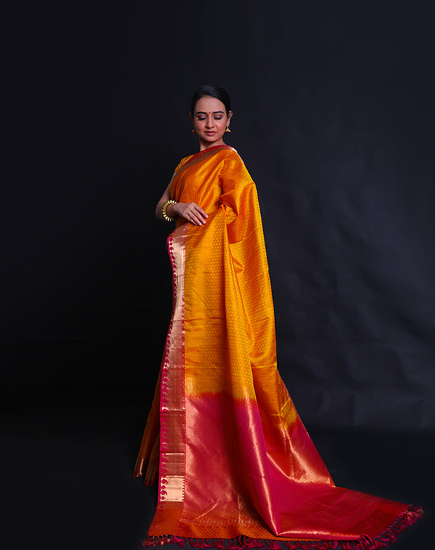 The mustard Kanjivaram soft silk saree with self buttis all over the drape sounds elegant and classic.- KSL02999