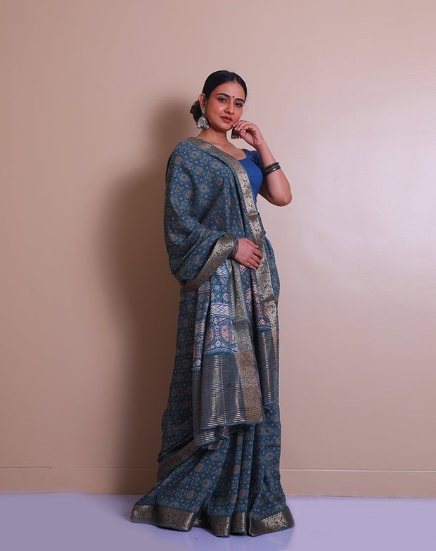 The blue blended saree with Ajrakh print all over the drape sounds absolutely stunning! - BLN01001