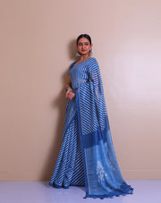 The blue blended saree with a modern print and a thin solid border sounds contemporary and chic. - BLN00932