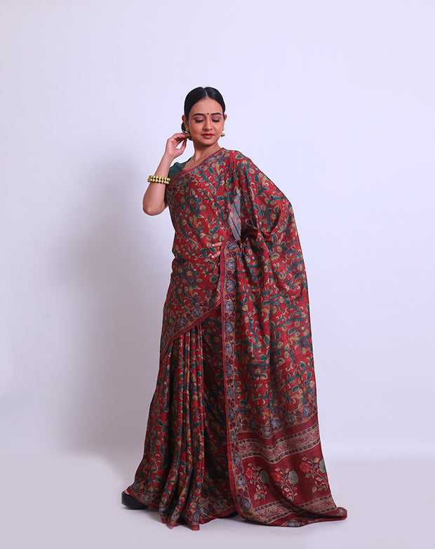 The maroon semi saree with Kalamkari print on the border, pallu, and all over the drape sounds beautiful - BLN00986