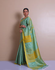 The saree is a lovely image of a sea green Kanjivaram silk saree with mustard accents - KSL03110