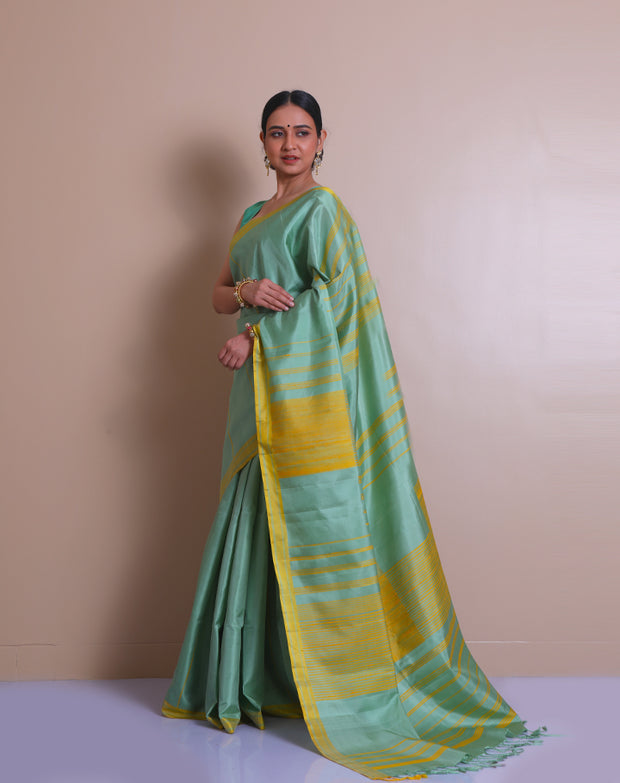 The saree is a lovely image of a sea green Kanjivaram silk saree with mustard accents - KSL03110