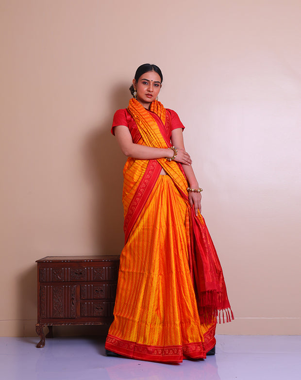 The Mustard Banarsi tanchui silk saree adorned with thread woven designs in contrast red on the border, pallu, - BSK09549
