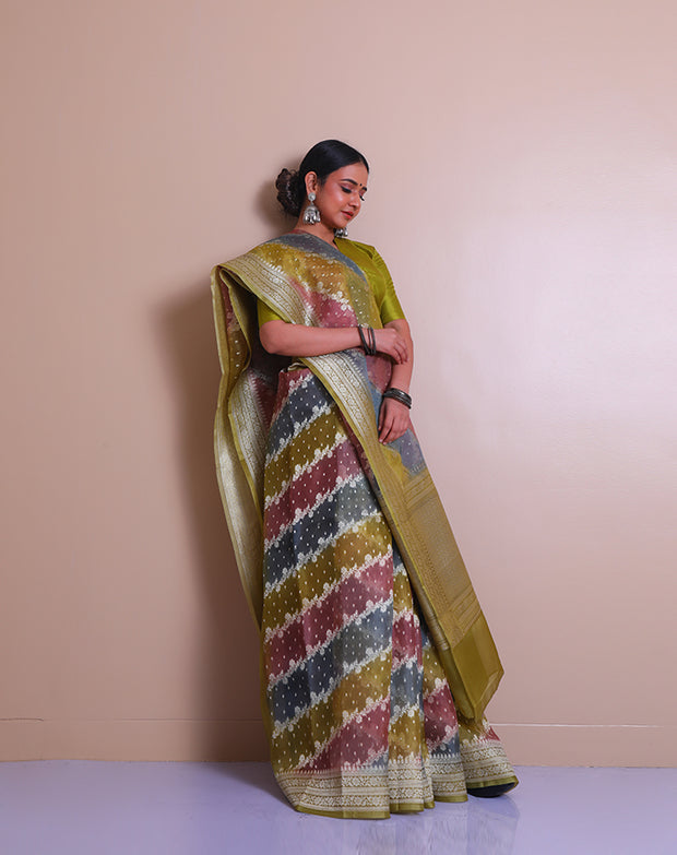 A multi Banarasi organza saree with multi-color and zari woven throughout the drape. - BSK010625