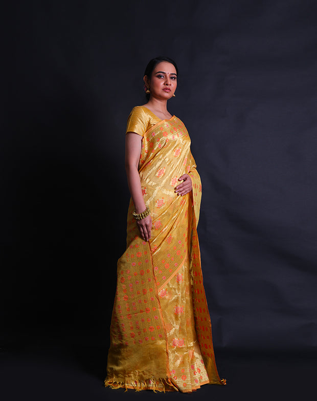 The mustard Banarasi kora tissue saree with gold zari and thread woven designs,- BSK010591