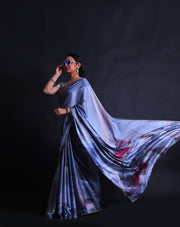 The grey blended satin crepe saree with different colors in digital modern print and stone embroidery all over the drape,- BLN01368