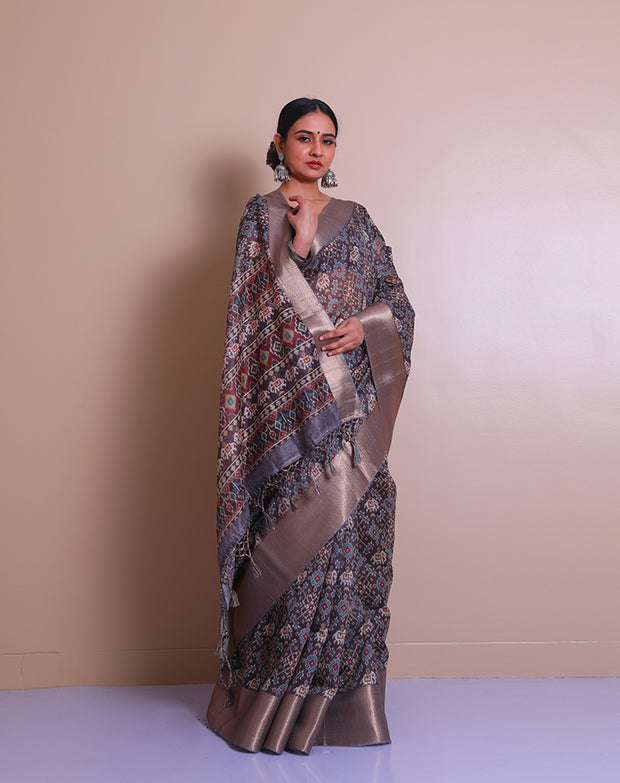 The linen brown blended saree with traditional print all over the drape and pallu sounds both classic and elegant. - BLN00967