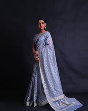 The light blue kora cotton saree with zari and thread woven buttis all over the drape,- BSK010529