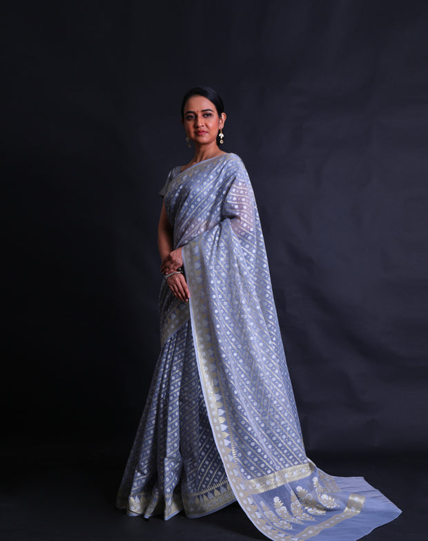 The light blue kora cotton saree with zari and thread woven buttis all over the drape,- BSK010529
