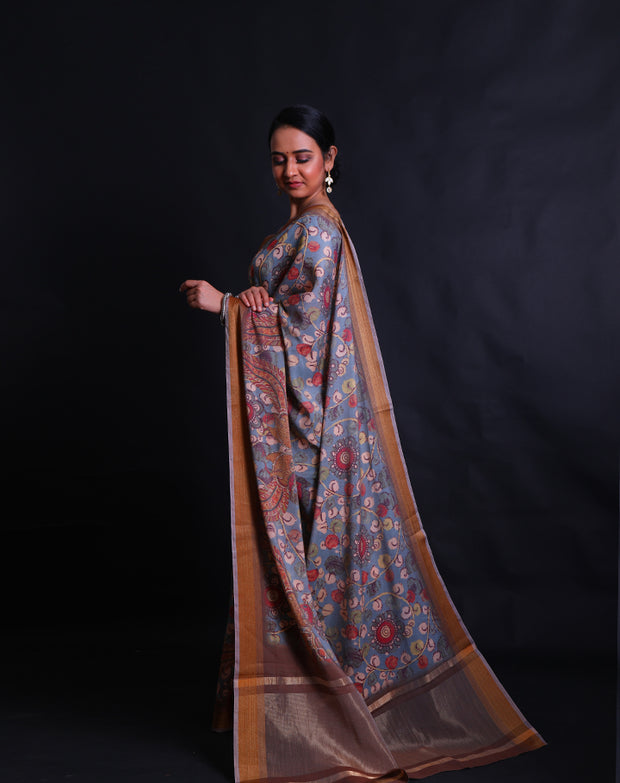 The light blue blended saree with Kalamkari print all over the drape sounds absolutely charming,- BLN00972