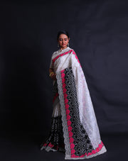 The black and white two-color organza saree with thread and zari embroidery featuring colorful rose flower design,- EMB03358