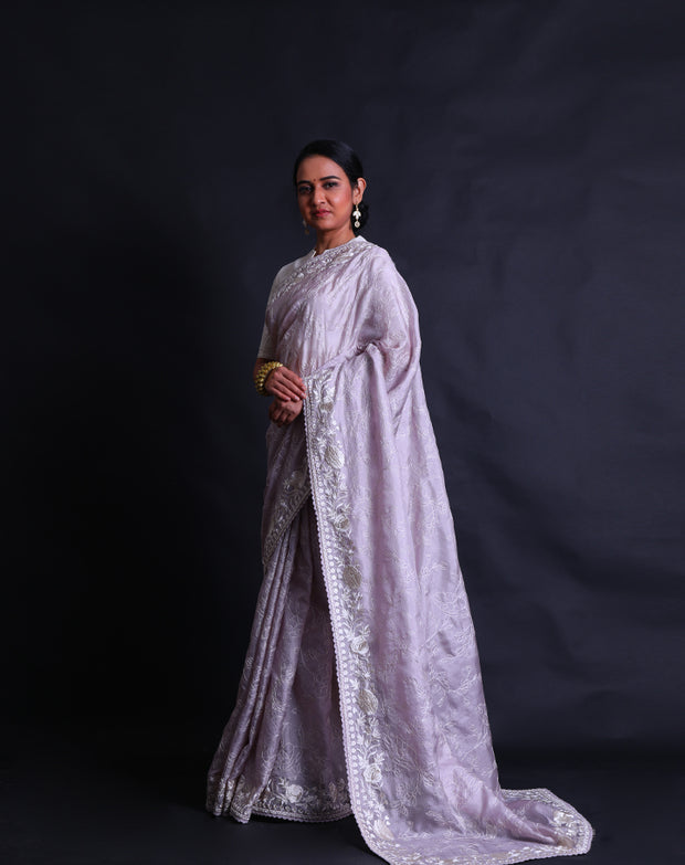 The lilac silk Kota saree with thread embroidery all over the drape sounds lovely and delicate.- EMB03357
