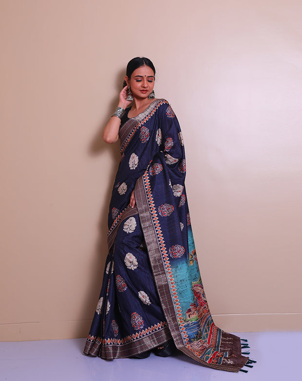 The dark blue semi-Tussar saree with batik print and mirror work all over the drape - BLN01343