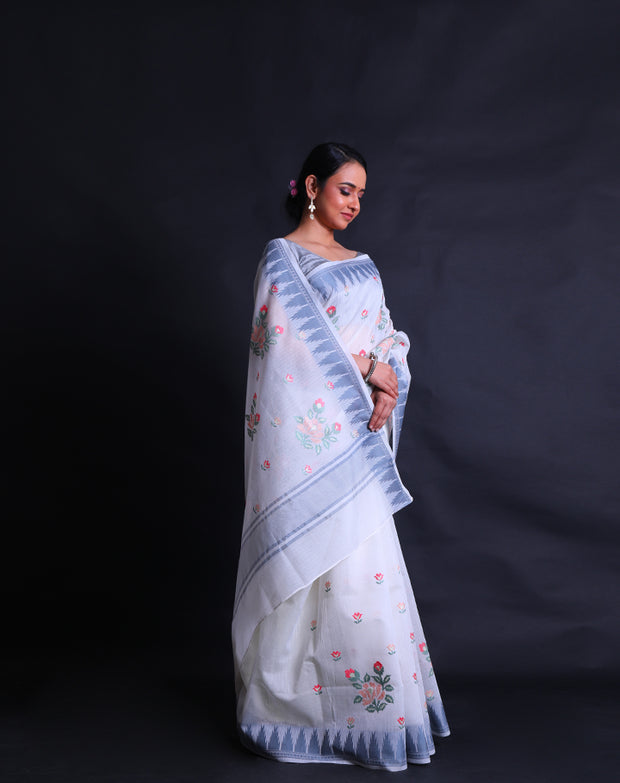 The white fancy supernet cotton saree adorned with colorful flower designs in machine embroidery sounds enchanting,- FCT011112