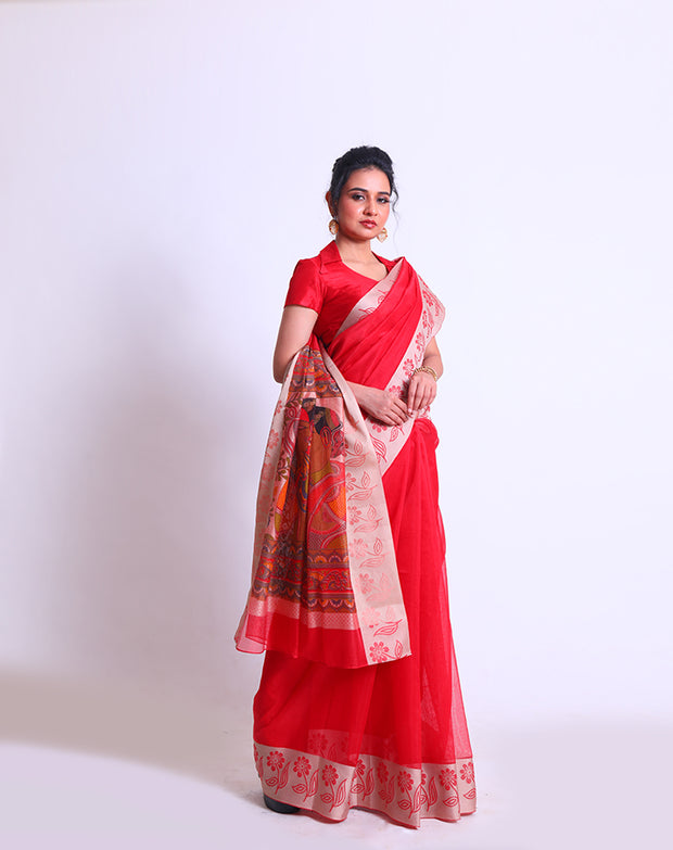 A Red Fancy Cotton saree with a woven border and a Kalamkari printed pallu offers a delightful blend of traditional and contemporary elements - FCT011147