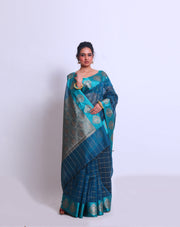 The Blue Fancy Cotton saree with Zari checks all over the drape and a Zari-woven pallu sounds absolutely exquisite - FCT011143