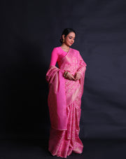 A pink cotton saree with self-woven designs and zari added throughout the drape,- FCT011114