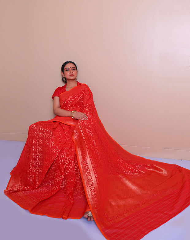The red Banarsi cotton Handloom saree with gold zari details on the border, pallu, - BSK010593