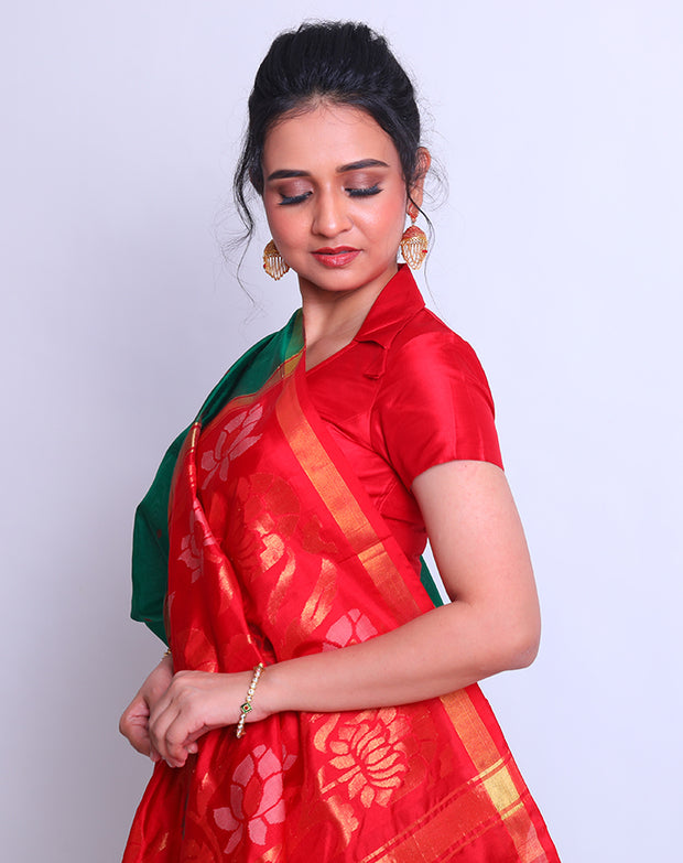 A Bottle Green Oppadda saree with Zari and red buttis all over the drape exudes elegance - OPD01739