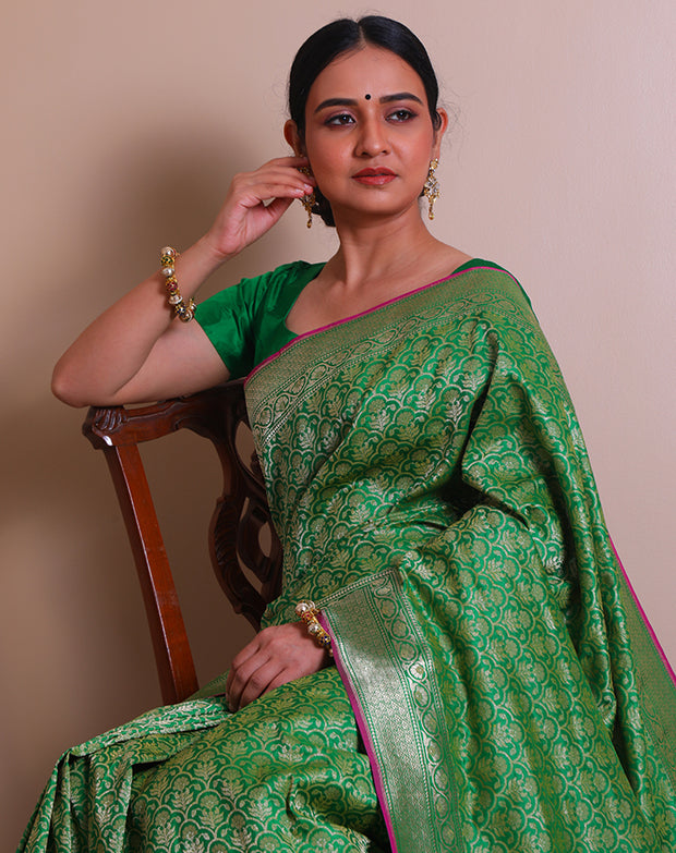 The green Banarsi Handloom silk saree with zari woven details on the border, pallu, - BSK07071