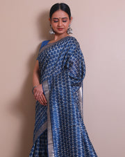 The indigo Tussar printed saree with a zari border and pallu sounds like a contemporary take on traditional elegance. - PTS05288
