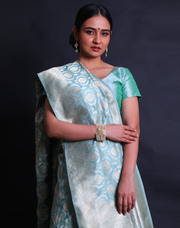 The light blue Banarasi silk saree with modern flower designs woven in zari sounds absolutely enchanting,- BSK010765