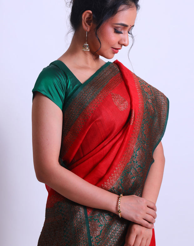 A Red Handloom Tussar saree with a green contrast and antique Zari woven on the border and pallu sounds stunning - BSK010681