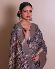 The linen brown blended saree with traditional print all over the drape and pallu sounds both classic and elegant. - BLN00967