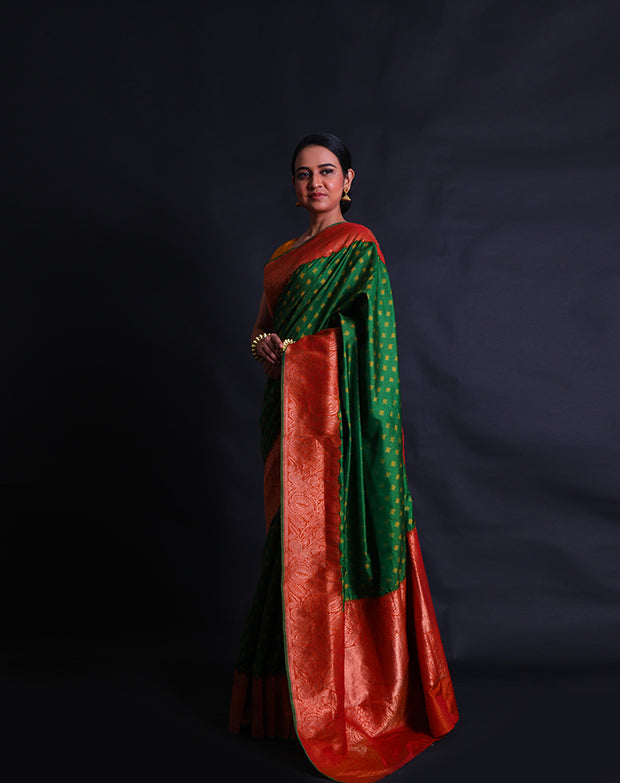 The green Rajkot Patola saree you described sounds stunning and richly detailed.- RPT00842