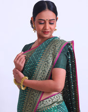 The bottle green fancy cotton saree with thread and zari woven all over the drape - BSK010448
