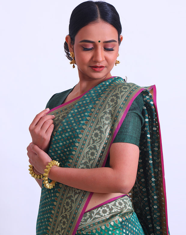 The bottle green fancy cotton saree with thread and zari woven all over the drape - BSK010448