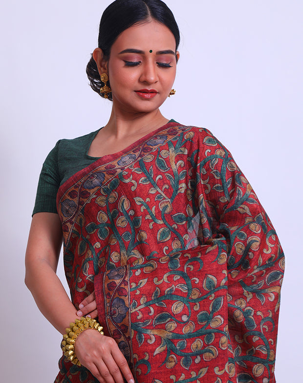 The maroon semi saree with Kalamkari print on the border, pallu, and all over the drape sounds beautiful - BLN00986