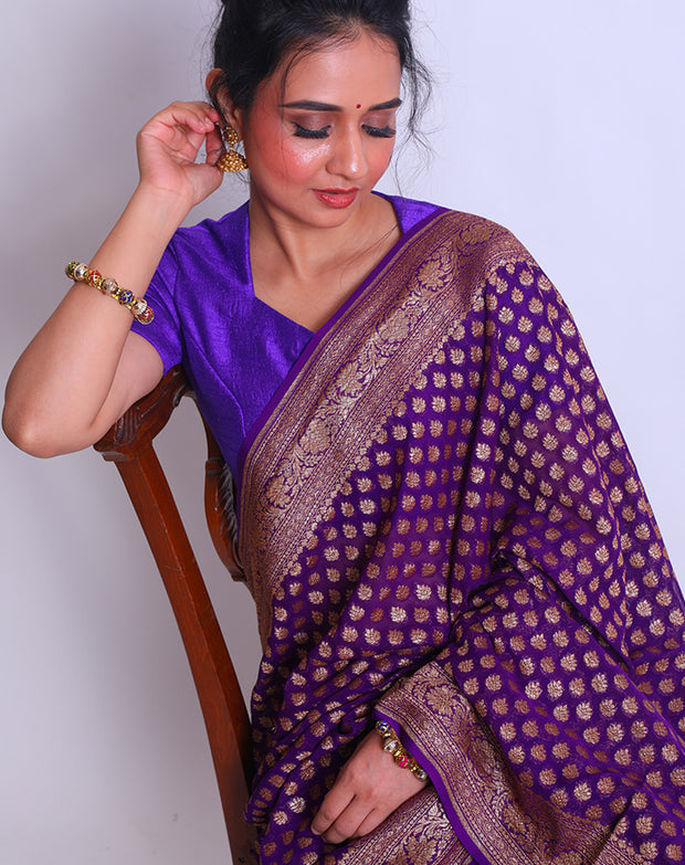 The Purple Khadi Georgette Handloom saree with an antique zari border and pallu sounds absolutely divine - CHG04054