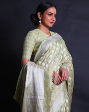The light green Banarasi silk saree you've described sounds enchanting,- BSK010346