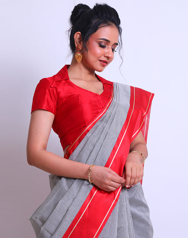 A White Cotton Saree with a checks design all over the drape offers a classic and timeless look - FCT011149