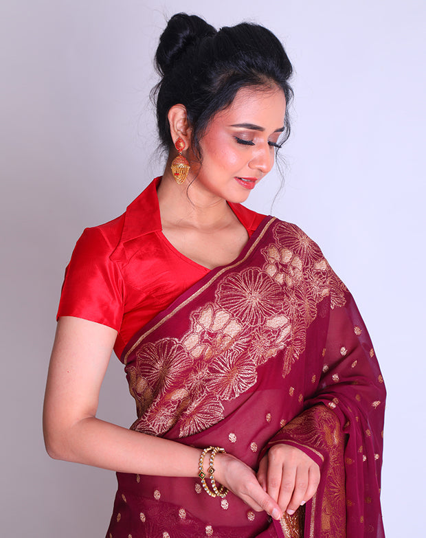 A Wine Khadi Georgette saree with Antique Zari woven on the border and pallu sounds luxurious - CHG04032