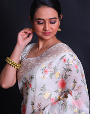 The off-white fancy cotton saree with shades of beige woven in thread as the border and pallu,- FCT011150