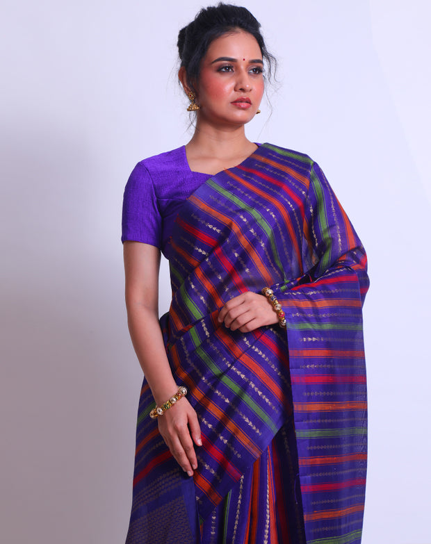 The Purple South Khora saree with colorful lines and triangle-shaped zari lines woven sounds like a delightful blend of traditional and contemporary elements - KSL03118