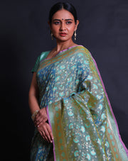The Green Banarasi silk saree you're describing sounds exquisite and intricate.- BSK010452