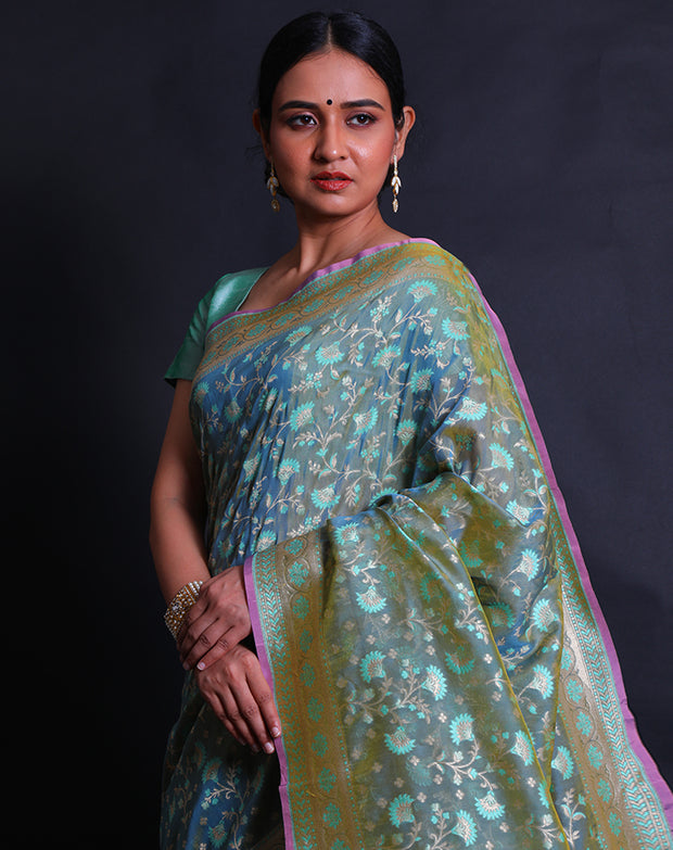 The Green Banarasi silk saree you're describing sounds exquisite and intricate.- BSK010452