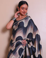 The black pure Tussar saree with modern print all over the drape, accented by a silver zari border - PTS05297