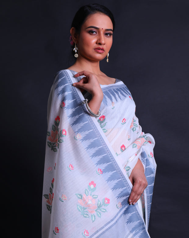 The white fancy supernet cotton saree adorned with colorful flower designs in machine embroidery sounds enchanting,- FCT011112