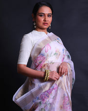 The pink organza saree with digital print in flower design all over the drape offers a modern and vibrant aesthetic.- BLN01555