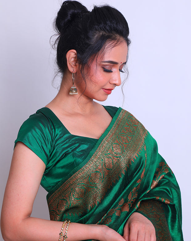 A Bottle Green Raw Silk Handloom Saree with an antique Zari border and pallu - BSK010651
