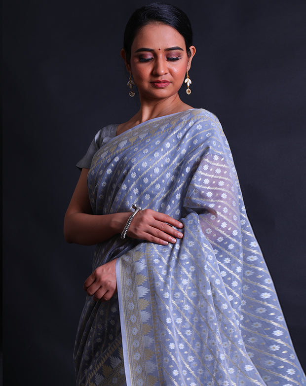 The light blue kora cotton saree with zari and thread woven buttis all over the drape,- BSK010529