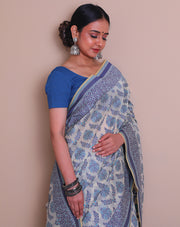 The beige cotton handloom saree with light blue and dark blue thread woven throughout sounds absolutely lovely - BSK010773